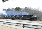 NS 6989 leads two other SD60E's and a GP38-2 across the Yadkin River bridge